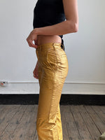 Comme Des Garçons gold trousers